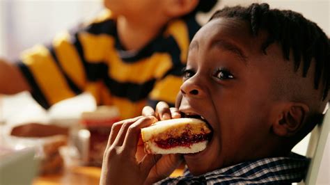 Eating A Peanut Butter And Jelly Sandwich