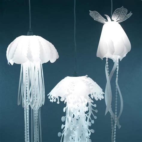 Three White Jellyfish Lights Hanging From Strings