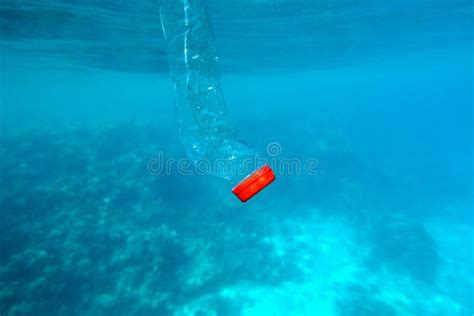 Plastic Bottle Floating In The Blue Sea Water World Ocean Contaminated