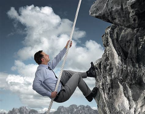 Business Man Climbing Mountain Stock Photos Pictures And Royalty Free