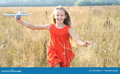Beautiful Little Blonde Girl Has Happy Fun Cheerful Smiling Face Red