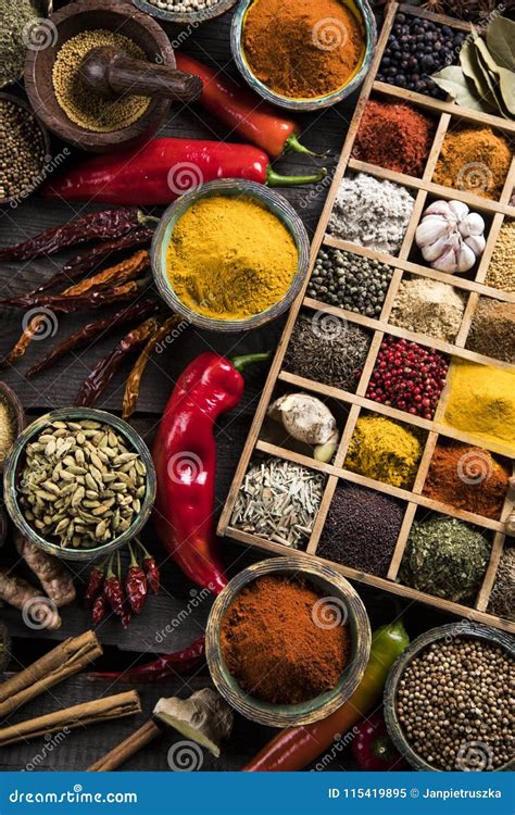 Close Up Of Different Types Of Assorted Spices In A Wooden Box Stock