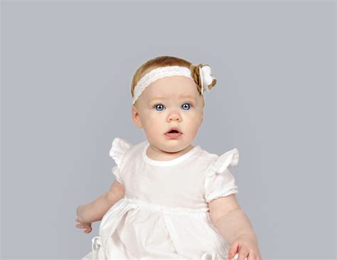Beautiful Little Baby Girl In A White Dress