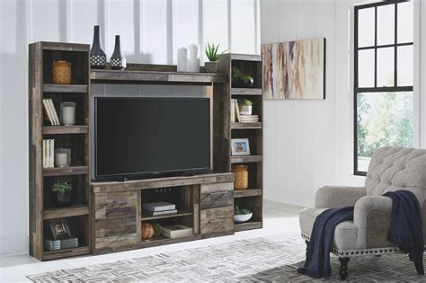 Trinell Center Large Tv Stand And 2 Tall Piers Sold At Hilton Furniture