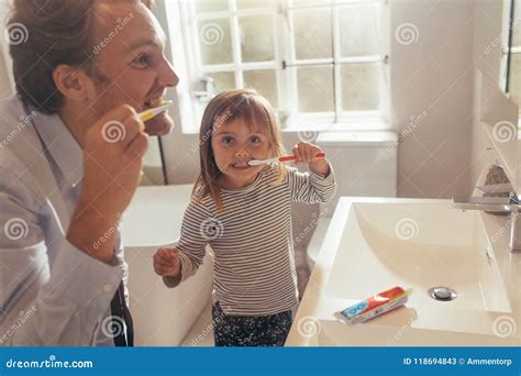 Father Teaching Daughter How To Brush Teeth Stock Image Image Of Brushing People 118694843