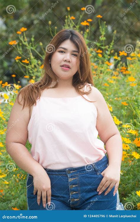 Portrait Of Asian Pretty Smiley Face Fat Woman Pose In The Park Stock