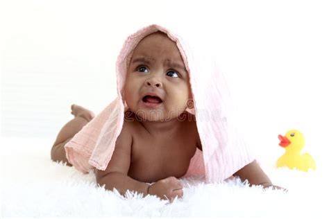 Portrait Of Adorable Six Month Crawling African American Baby Covered