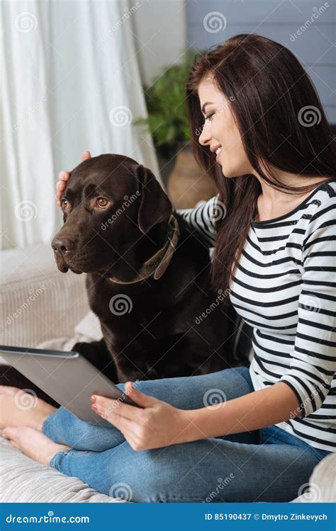Nice Smiling Woman Distracted By Her Cute Dog Stock Image Image Of