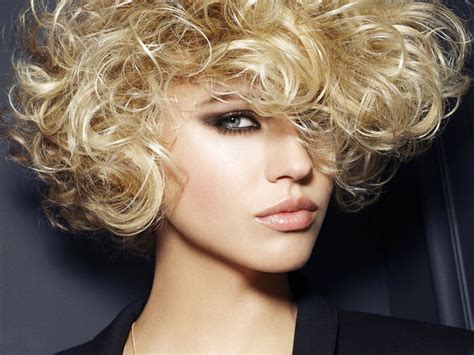 Layers give the unruly curls shape, and a part further structures the cut. Short Hairstyles for Natural Curly Hair