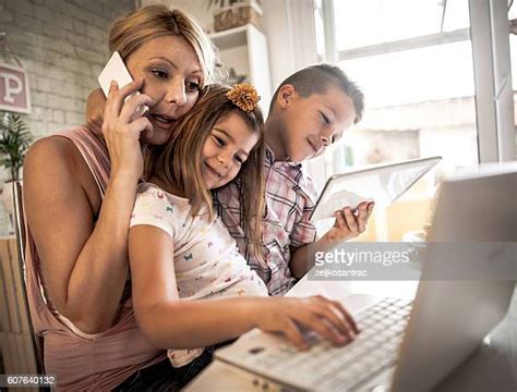 Son Showing Mom Phone Photos And Premium High Res Pictures Getty Images