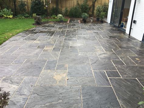 We have what you need to complete your look. A Stand-Out Black Indian Sandstone Paving Area Brings a ...