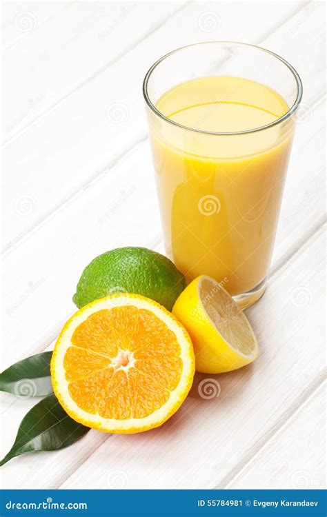 Citrus Fruits And Glass Of Juice Orange Lime And Lemon Stock Image