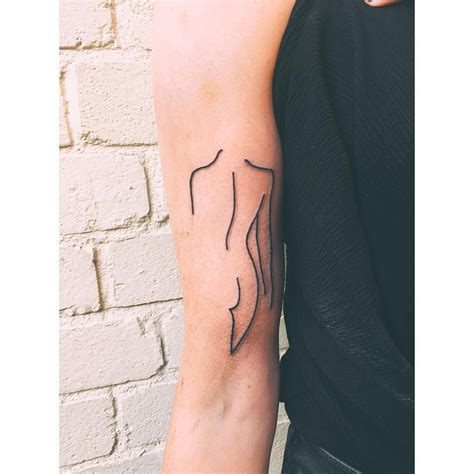 Tattoo Of A Woman’s Silhouette On The Right Upper Arm Sun Tattoos Line Art Tattoos Face