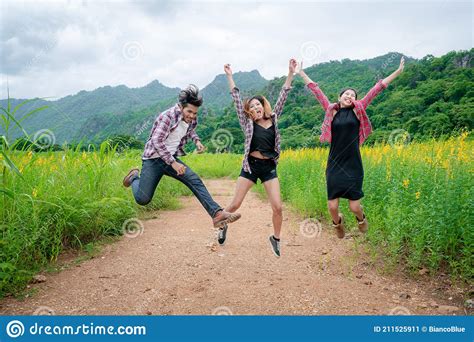 Group Of Happy Young People Jumping In The Air Stock Image Image Of