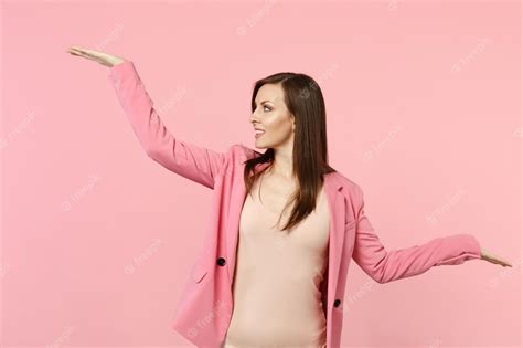 Premium Photo Portrait Of Smiling Woman Wearing Jacket Looking Spreading And Pointing Hands