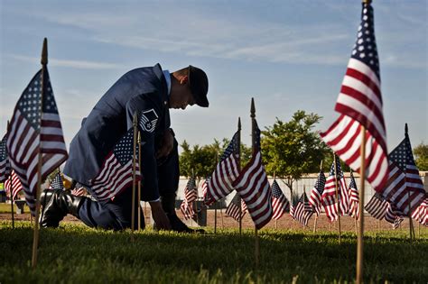 Airmen place flags at the Southern Nevada Veterans Memorial Cemetery