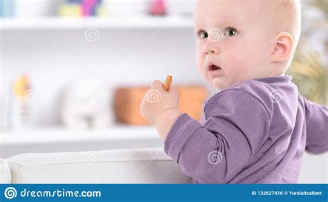 Portrait Of Pretty Baby Standing On The Couch Stock Photo Image Of