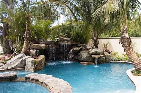 I accept the privacy policy. LOVE IT!! Lagoon Pool with Grotto, Waterfall, Spa, and Fire Pit! What else do… | Pool waterfall ...