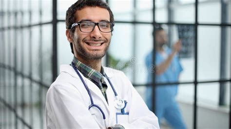 Cheerful Mature Doctor Posing And Smiling At Camera Healthcare And
