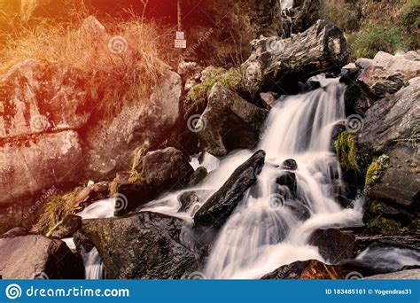 Beautiful Waterfall Of Silky Water Going Down The Mountain Stock Image