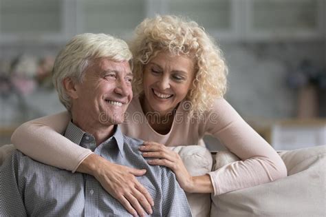 Older Smiling Wife Hugs Her Beloved Cheerful Husband Stock Image