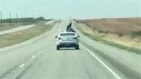 Texas Prisoner Escapes Restraints Climbs On Top Of Moving Car Mid