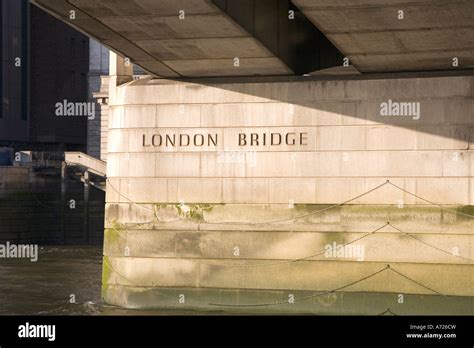 Beneath London Bridge Taken From The River Thames In Sun Sunshine