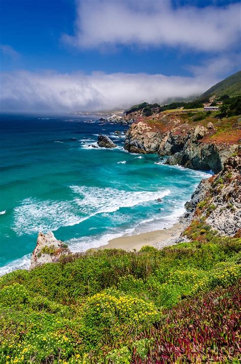 An Ocean View With Waves Crashing On The Shore