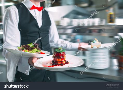 Waiter Serving Motion On Duty Restaurant Stock Photo Edit Now 1222987807