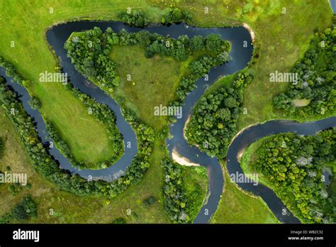 Top View Of The Beautiful Landscape Green Field Meandering River