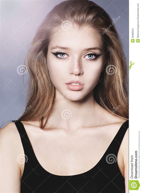 Portrait Of A Beautiful Girl With Long Hair Stock Photo