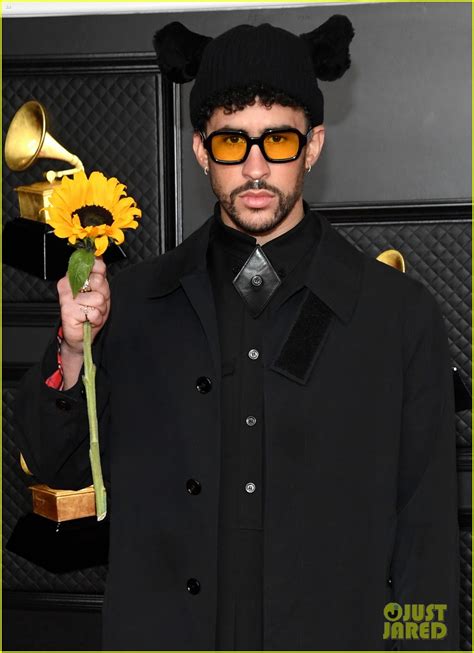Bad Bunny Holds Up A Sunflower At Grammys 2021 Red Carpet Photo