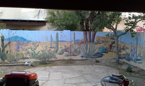 Whether used for an outdoor garden wall or as an interior basement wall, paint provides one answer for dressing up the boring gray blocks. Desert landscape mural on backyard cinder block wall ...