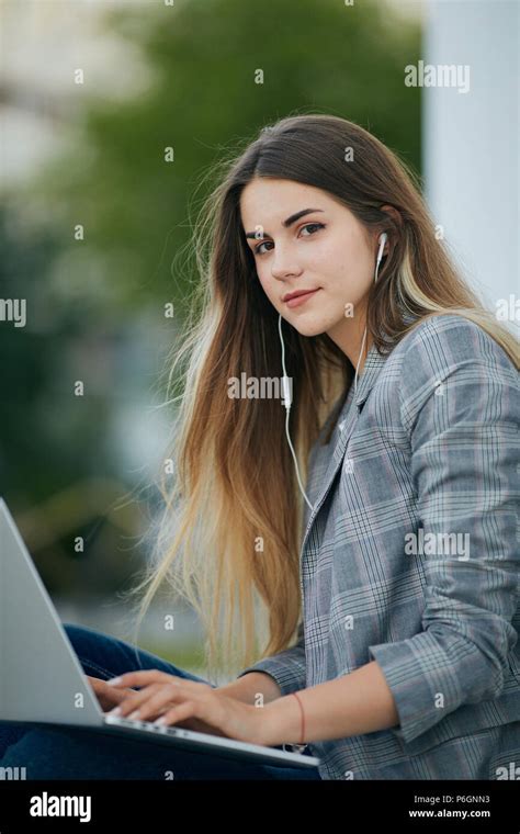 Pretty Girl Sit With Her Laptop And Stydy White Background Stock Photo