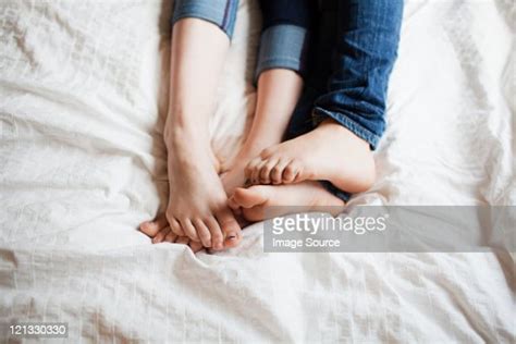 Two Teenage Girls Playing Footsie Photo Getty Images