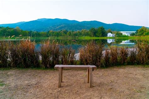 Premium Photo Wood Bench With Beautiful Lake At Chiang Mai With