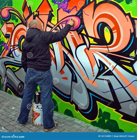Graffiti Artist Spray Painting Wall Art Editorial Image Cartoondealer