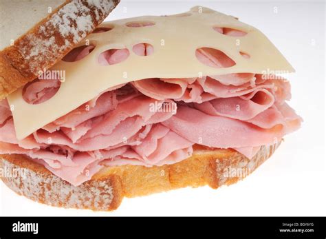 Front Of An Open Ham And Swiss Cheese Sandwich On White Bread On A