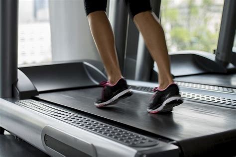 A Woman Is Running On A Treadmill