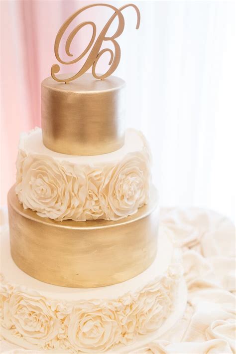Tiered Ivory And Gold Wedding Cake