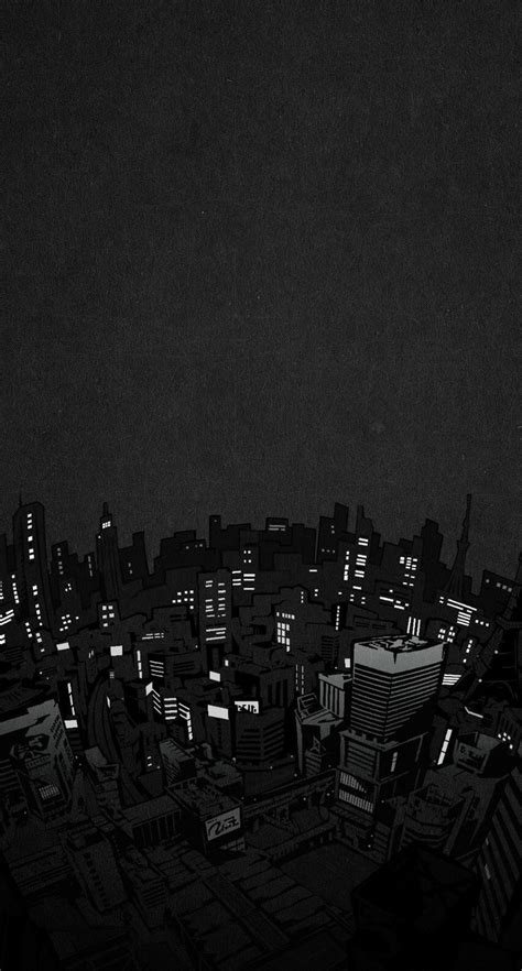 A Black And White Photo Of The City At Night