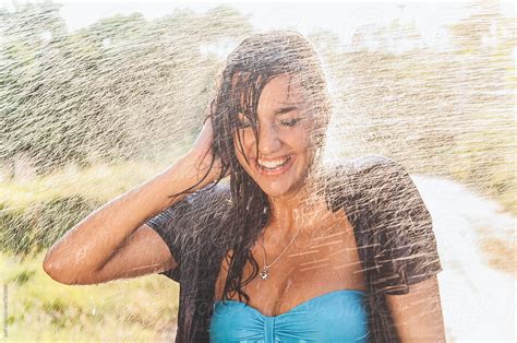 girl getting sprayed with water by paff girl carwash