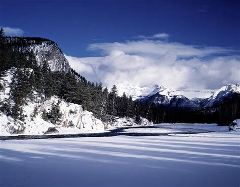 The Snow Covered Bow River Running Photograph By Todd Korol Fine Art