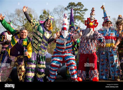 Wearing Traditional Cajun Mardi Gras Costume And Mask Participants Make