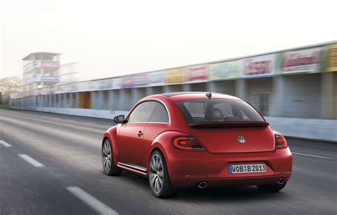 2012 Volkswagen Beetle In Red Rear Exterior In Motion Automotive Addicts