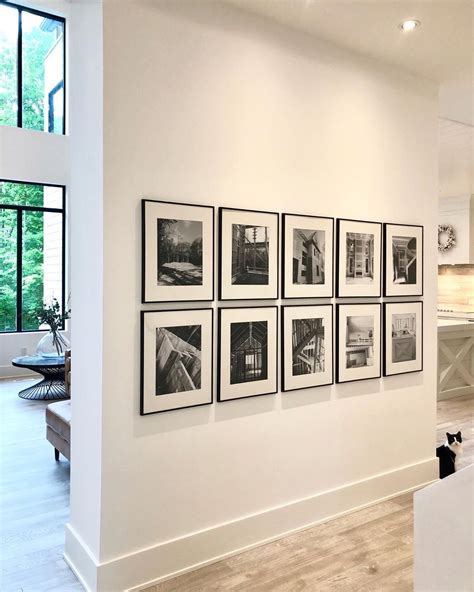 We really loved this doing this black framed gallery wall feature in our front hall so w ...