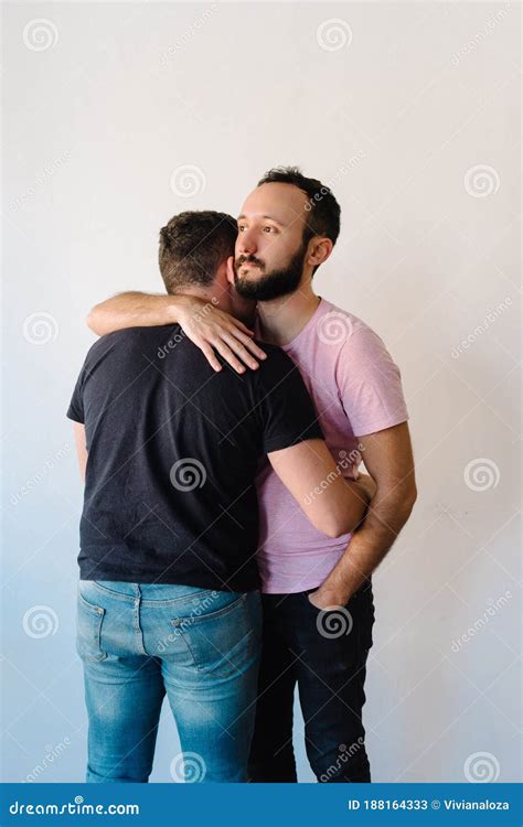 two gay man hugging each other stock image image of beard home 188164333