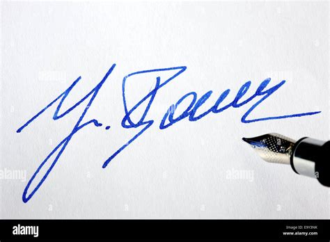 Handwritten signature with pen on a letter Stock Photo: 74969039 - Alamy
