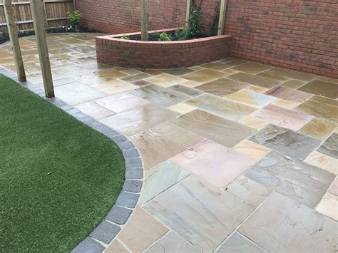 Buff Indian Sandstone With A Grey Drivesett Block Border When Wet The