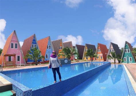 The unique triangular houses, is filled with colourful exterior and an outdoor swimming pool for both adults and children, perfect for a family vacation. Masbro Village: Homestay Unik Warna-Warni & Pernah Dinobat ...
